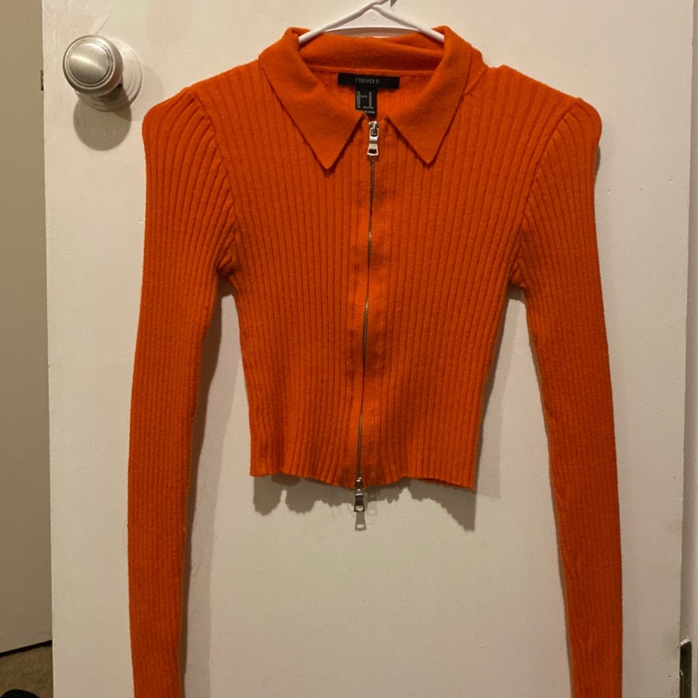 Its a zip up sweater , very fitted and cute.
